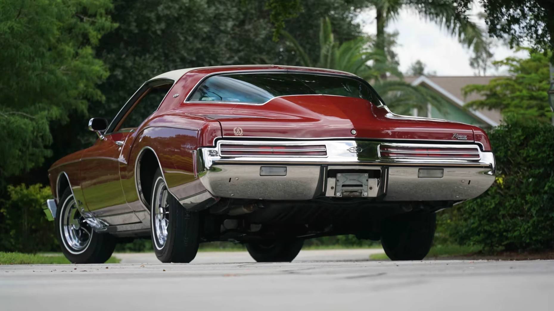 Low-angle rear 3q view of a red 1973 Buick Riviera