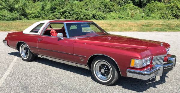 Left front 3q view of a red 1974 Buick Riviera