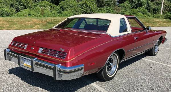 Right rear 3q view of a red 1974 Buick Riviera